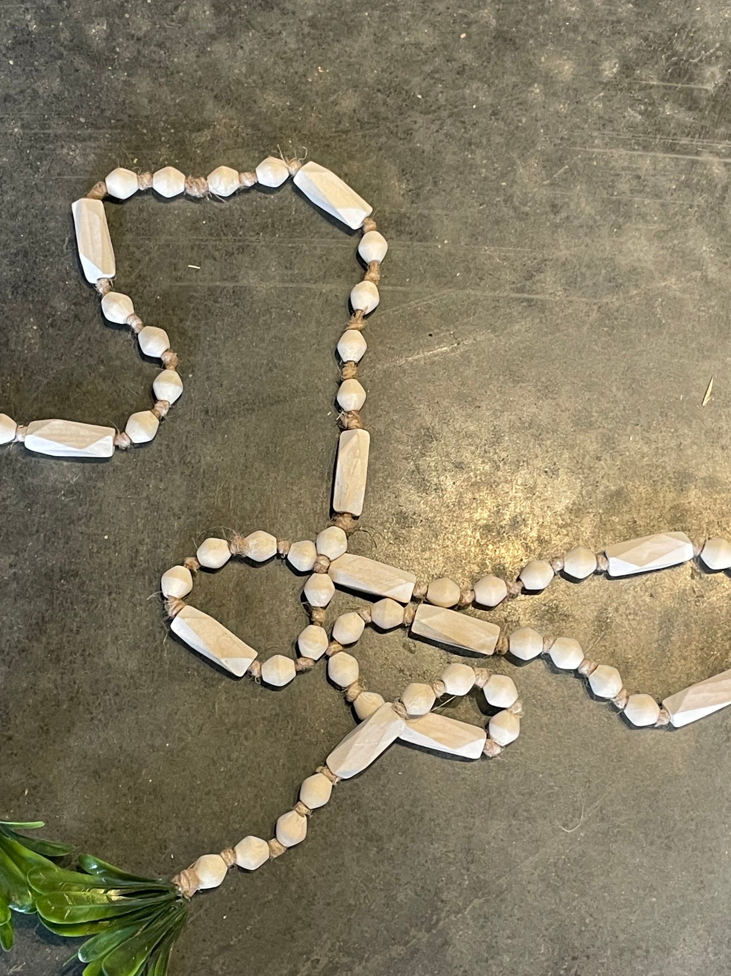 72” Paulownia Wood Bead garland w/ Faux Greenery & Tassel